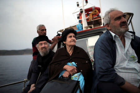 Residents of Fournoi use a sea taxi to cross from the islet of Thymaina, Greece, May 12, 2017. REUTERS/Alkis Konstantinidis