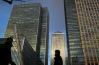 FILE PHOTO: People walk through the Canary Wharf financial district of London, Britain, December 7, 2018. REUTERS/Simon Dawson/File Photo