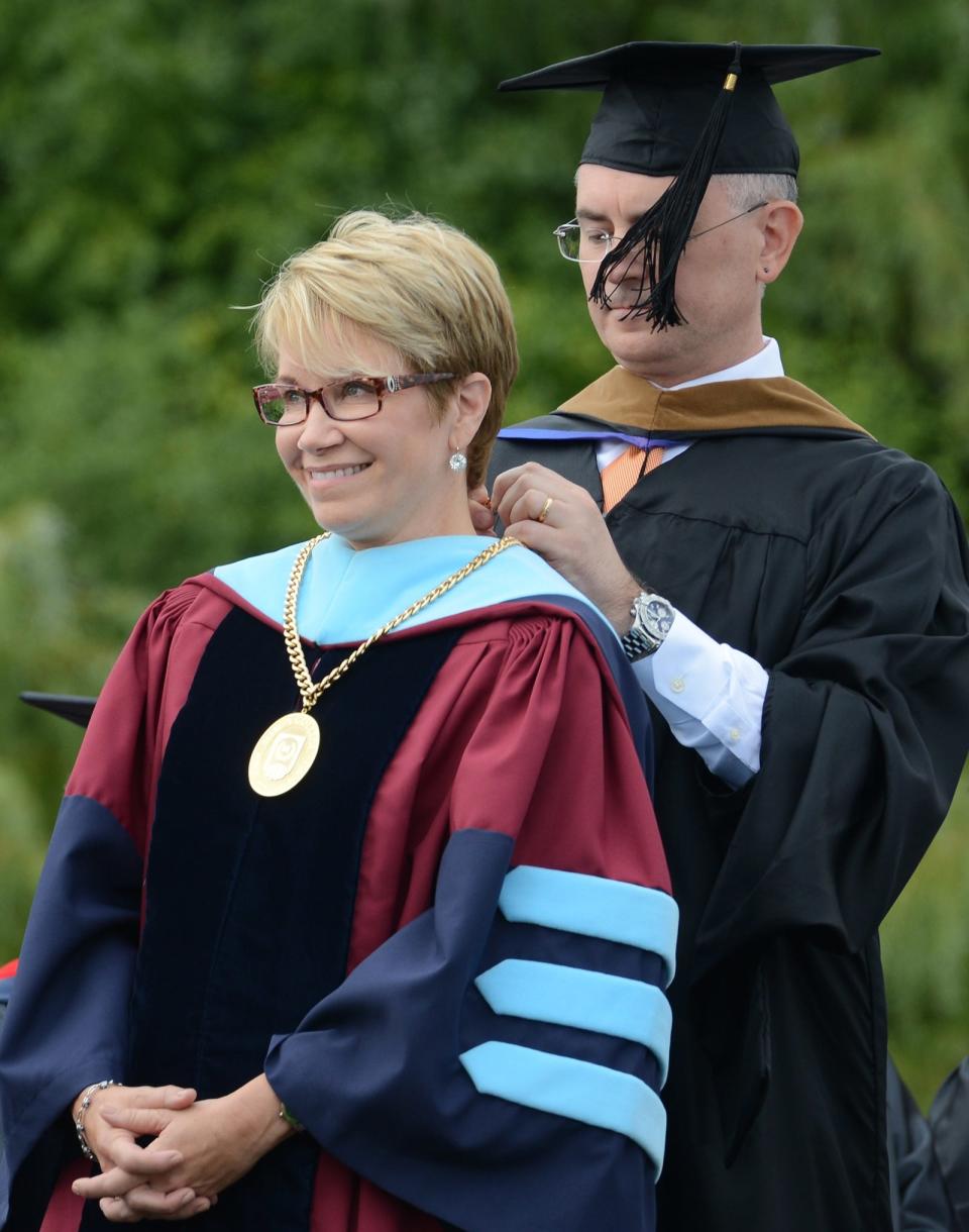 Tina Russell / Observer-Dispatch The presidential medallion is placed around the neck of Laura Casamento by Mark Pilipczuk, Utica College Board of Trustees Chairman, during her inauguration of becoming Utica College's new President at the Gaetano Stadium at Utica College Friday, Sept. 23, 2016.