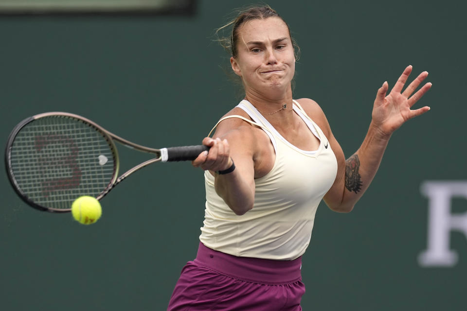 Aryna Sabalenka, of Belarus, returns a shot against Elena Rybakina, of Kazakhstan, during the women's singles final at the BNP Paribas Open tennis tournament Sunday, March 19, 2023, in Indian Wells, Calif. (AP Photo/Mark J. Terrill)