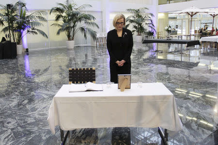 Finnish Interior Minister Paula Risikko offers condolences to one of the victims, the chairman of the city council Tiina Wilen-Jappinen, in Imatra, Finland December 5, 2016. Lehtikuva/Lauri Heino/via REUTERS ATTENTION EDITORS - THIS IMAGE WAS PROVIDED BY A THIRD PARTY. FOR EDITORIAL USE ONLY. NO THIRD PARTY SALES. NOT FOR USE BY REUTERS THIRD PARTY DISTRIBUTORS. FINLAND OUT. NO COMMERCIAL OR EDITORIAL SALES IN FINLAND.