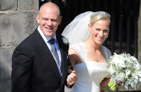 <p>Back in 2011, the Queen’s granddaughter Zara Phillips married former England rugby captain Mike Tindall at a small church ceremony in Edinburgh. The couple decided to keep the ceremony relatively low-key with only a handful of royal family members in attendance.<br>The bride chose an ivory silk and satin gown by Stewart Parvin, one of the Queen’s favourite couturiers, for the big day. She accessorised the look with a Greek tiara borrowed from her mother Princess Anne and Jimmy Choo shoes. <em>[Photo: Getty]</em><br></p>