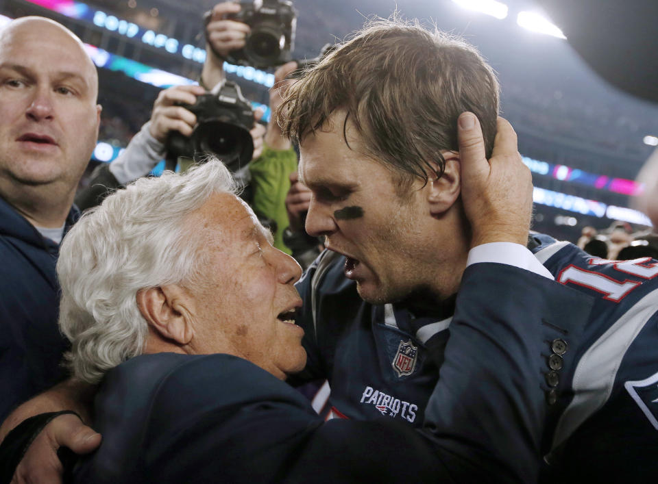 FILE - In this Jan. 21, 2018, file photo, New England Patriots owner Robert Kraft, left, embraces quarterback Tom Brady after defeating the Jacksonville Jaguars in the AFC championship NFL football game in Foxborough, Mass. Brady, the centerpiece of the New England Patriots’ championship dynasty over the past two decades, appears poised to leave the only football home he has ever had. The 42-year-old six-time Super Bowl winner posted Tuesday, March 17, 2020, on social media “my football journey will take place elsewhere.” The comments were the first to indicate the most-decorated player in NFL history would leave New England. (AP Photo/Winslow Townson, File)