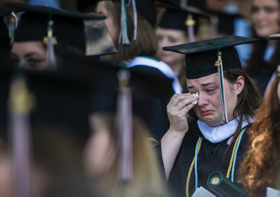 A graduate cries during the final commencement ceremony at Sweet Briar College on May 16, 2015. The school is closing this summer due to funding shortfall. (Photo: Jabin Botsford/The Washington Post via Getty Images)