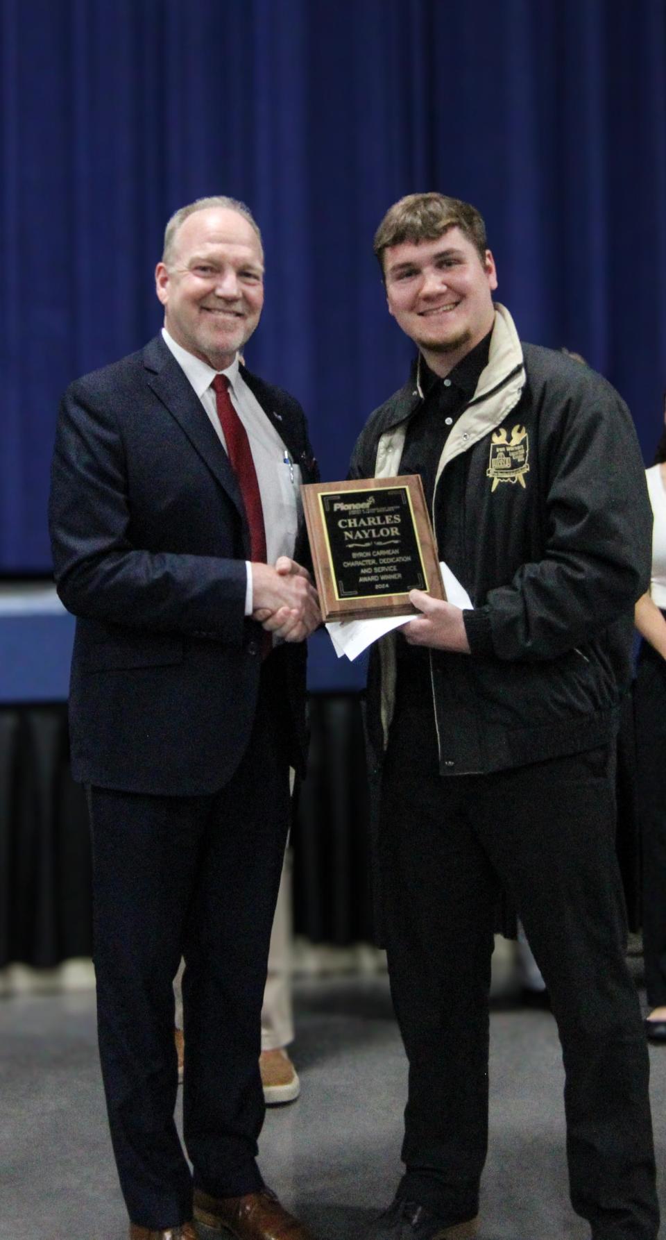 Pioneer Superintendent Greg Nickoli (left) presents Charles Naylor with the 2024 Byron H. Carmean Award.