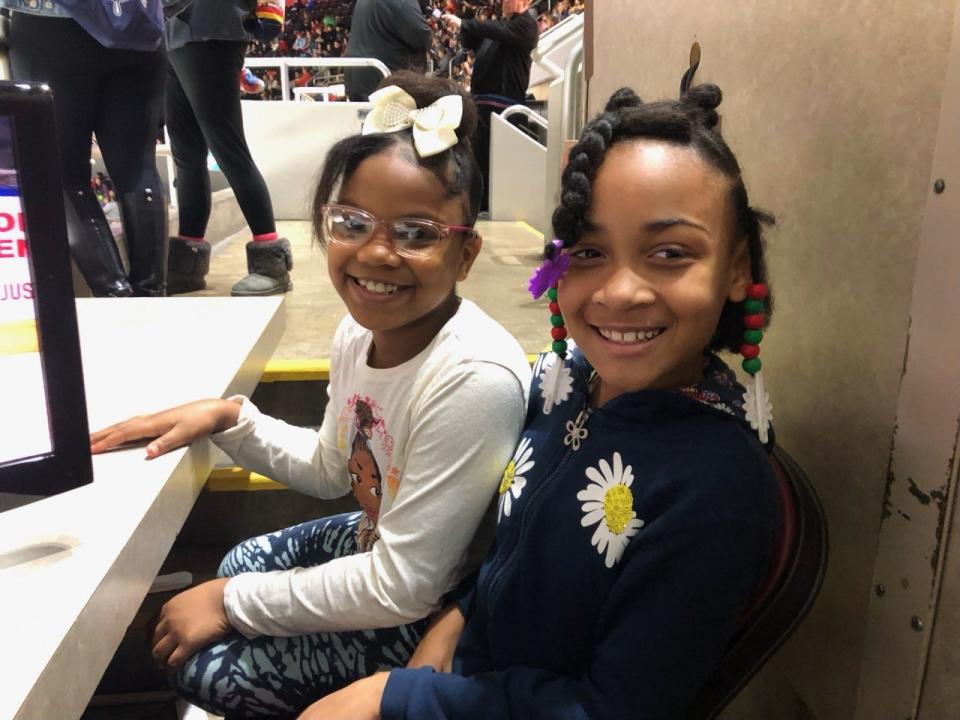 Mi'Airrah Pate-Henderson (on right) and Aleyria Steele, third-graders at Norwood, were watching their first Peoria Rivermen game as part of the team's Education Day event, a morning game that drew 6,878 to Carver Arena on Thursday, Dec. 15, 2022.