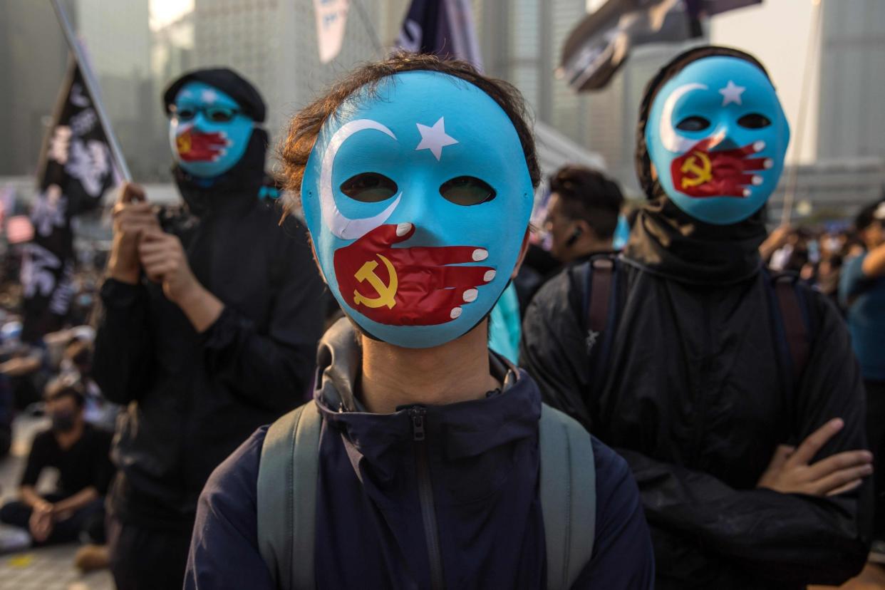 Protesters attend a rally in Hong Kong to show support for the Uighur minority in China: AFP/Getty