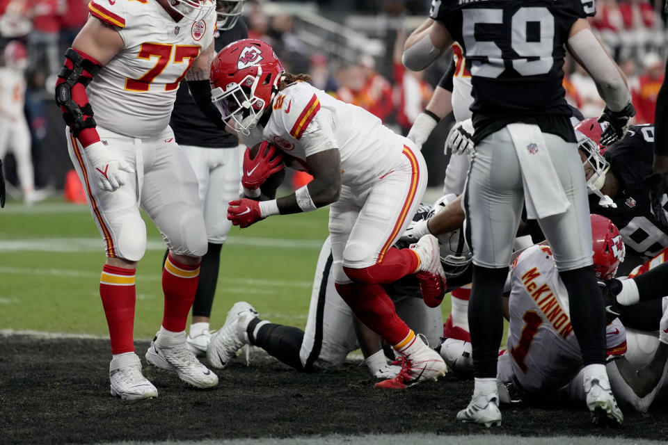 Kansas City Chiefs running back Ronald Jones II (2) scores during the first half of an NFL football game against the Las Vegas Raiders Saturday, Jan. 7, 2023, in Las Vegas. (AP Photo/John Locher)