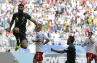 <p>Australia’s Mile Jedinak, left, celebrates scoring his side’s opening goal during the group C match between Denmark and Australia at the 2018 soccer World Cup in the Samara Arena in Samara, Russia, Thursday, June 21, 2018. (AP Photo/Gregorio Borgia) </p>