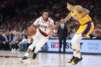 Oct 18, 2018; Portland, OR, USA; Portland Trail Blazers guard Evan Turner (1) drives on Los Angeles Lakers forward Kyle Kuzma (0) in the second half at Moda Center. Mandatory Credit: Jaime Valdez-USA TODAY Sports