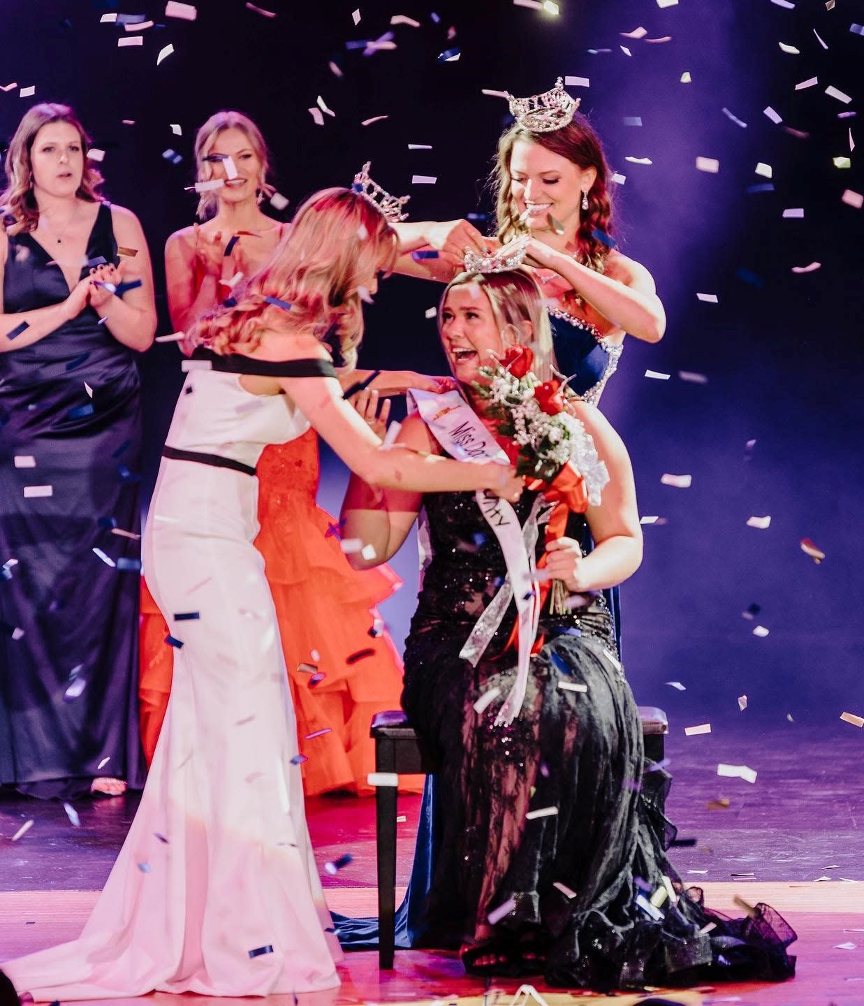 Lindsay Schuh receives her crown as Miss Door County 2023 from outgoing Miss Door County 2022 Chloe Staudenmaier, behind Schuh, and Miss Door County Outstanding Teen 2022 Claire Bohn during the pageant held Feb. 4 at Southern Door Community Auditorium.