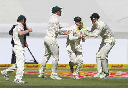 Cricket - South Africa vs Australia - Third Test - Newlands, Cape Town, South Africa - March 22, 2018 Australia's Steve Smith celebrates with team mates after catching out South Africa's Aiden Markram REUTERS/Mike Hutchings