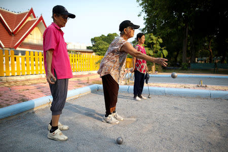 Elderly people play petanque at Bangkhae Home Foundation in Bangkok, Thailand, April 27, 2016. REUTERS/Athit Perawongmetha