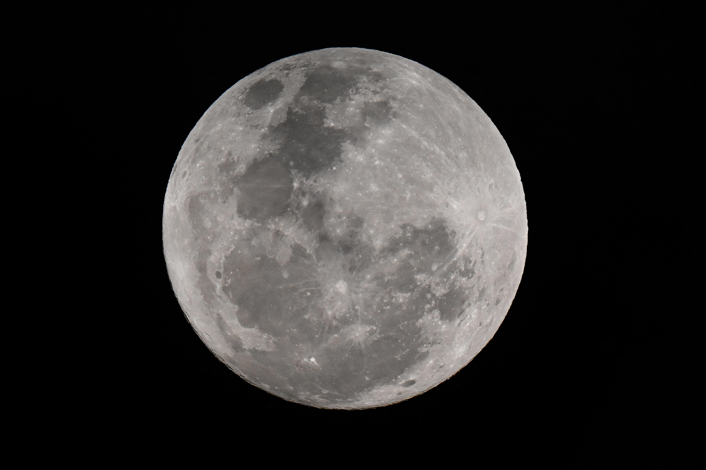 A blue supermoon appears in the night sky over Sydney on Monday. 