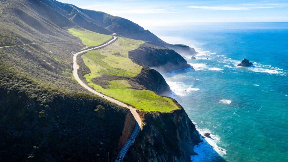 Highway 1 California USA Raod on Ocean, Hills and fields are surrounding the picture