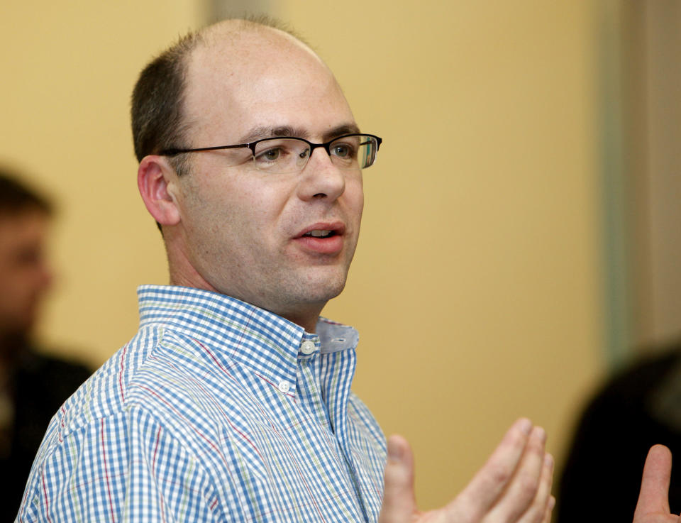 In this Feb. 10 2015 photo, Madison Alderman Matt Phair speaks in Madison, Wisc. Searchers on Tuesday, Aug. 21, 2018, recovered the body of a man who was wrenched away from would-be rescuers during flash flooding that forced evacuations around Wisconsin's capital city and cut power to many homes. The Capital Times reported that Phair and his wife were out biking during a lull in the storm and saw the car in the ditch. Phair told the newspaper they waded up to the car in water that was three or four feet deep, and he pulled out the two passengers, who were described by police as a man in his 70s and a woman in her 50s. The male passenger made it to solid ground but the woman slipped under. Phair said he and his wife saved her by grabbing her hair. (Michelle Stocker /Wisconsin State Journal via AP)