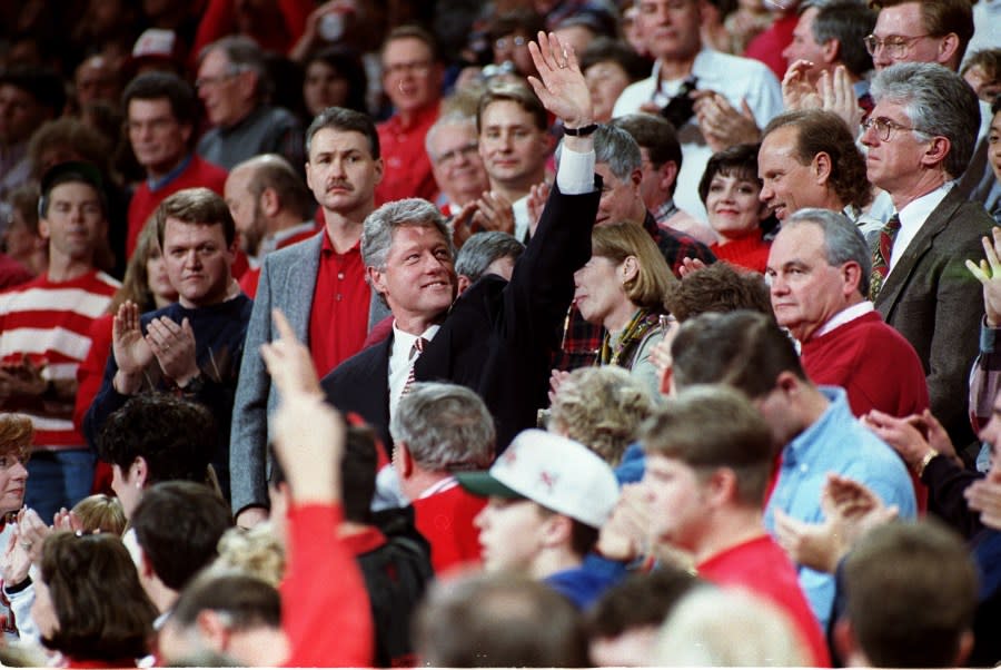 28 DEC 1993: PRESIDENT BILL CLINTON WAVES TO THE CROWD DURING A NON-CONFERENCE GAME BETWEEN THE ARKANSAS RAZORBACKS AND THE TEXAS SOUTHERN TIGERS.