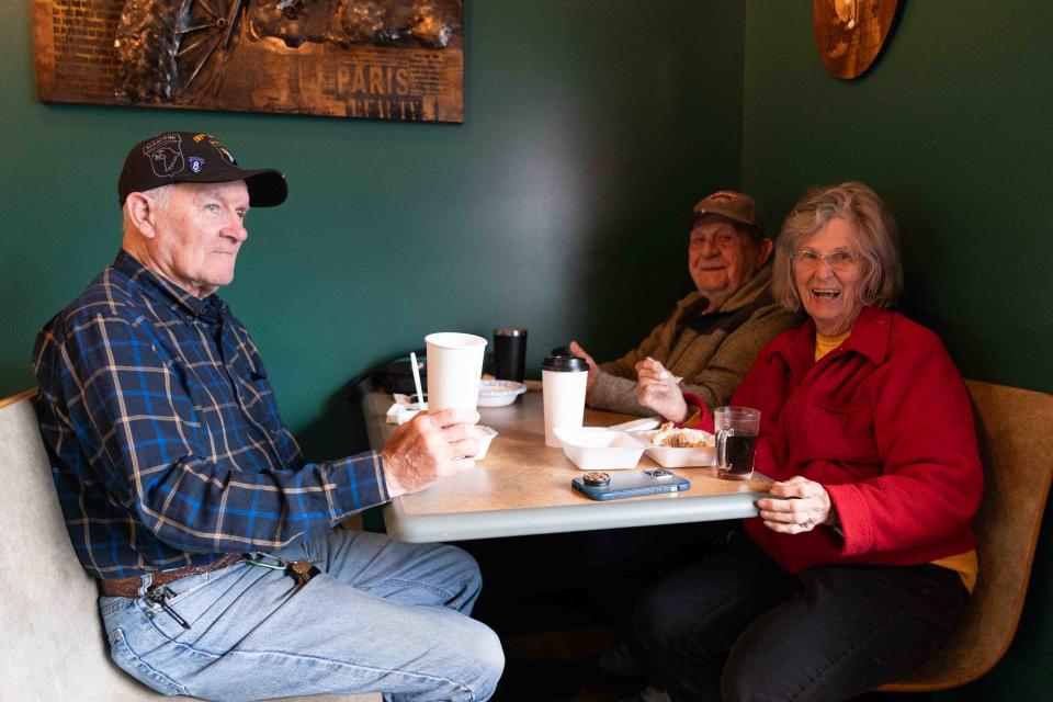 Auburn regulars, from left, Les Callepp, Jim Underberg and Peggy Herzog enjoy breakfast at The Forgotten Grain Bakery & Bistro on Thursday. "It is wonderful," Herzog said. "We can come in and she practically knows what we want."