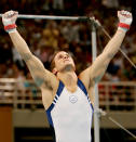 ATHENS - AUGUST 18: Paul Hamm of the USA celebrates after the horizontal bar at the men's artistic gymnastics individual competition on August 18, 2004 during the Athens 2004 Summer Olympic Games at the Olympic Sports Complex Indoor Hall in Athens, Greece. (Photo by Donald Miralle/Getty Images)