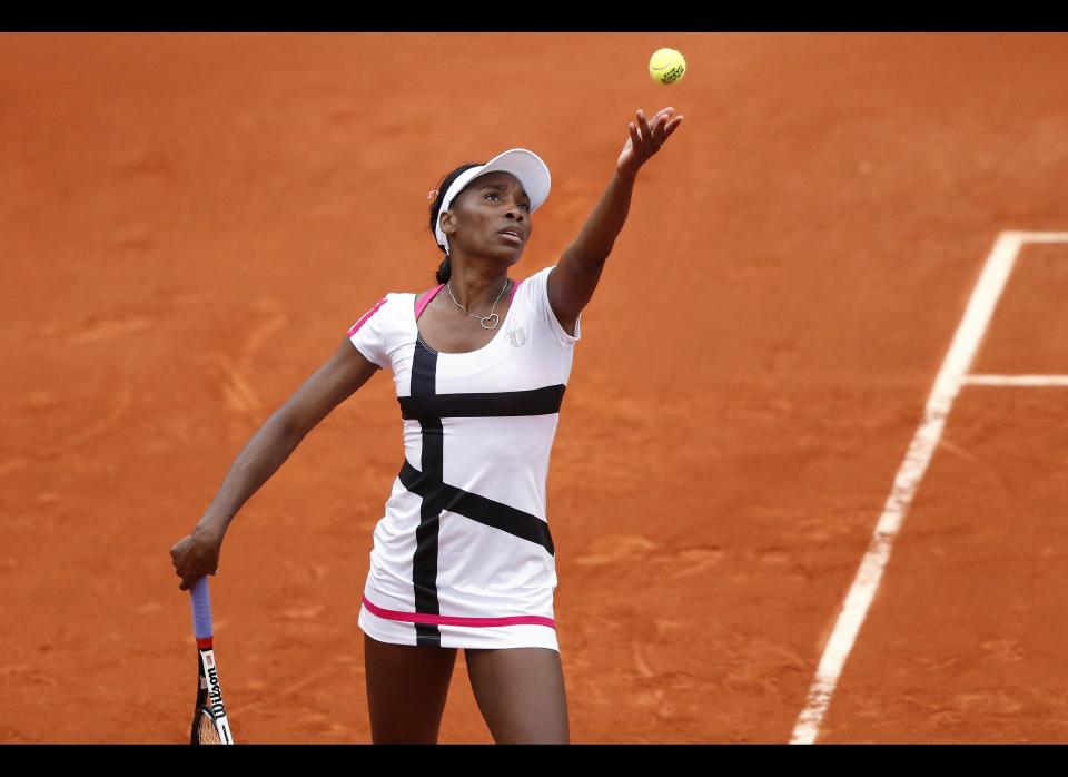 US Venus Williams serves to Poland's Agnieszka Radwanska during their Women's Singles 2nd Round tennis match of the French Open in Paris.        (KENZO TRIBOUILLARD/AFP/GettyImages)