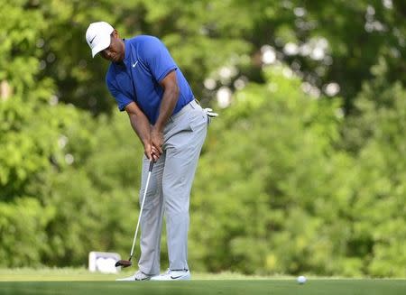 Aug 11, 2018; Saint Louis, MO, USA; Tiger Woods putts on the 15th green during the third round of the PGA Championship golf tournament at Bellerive Country Club. Jeff Curry-USA TODAY Sports