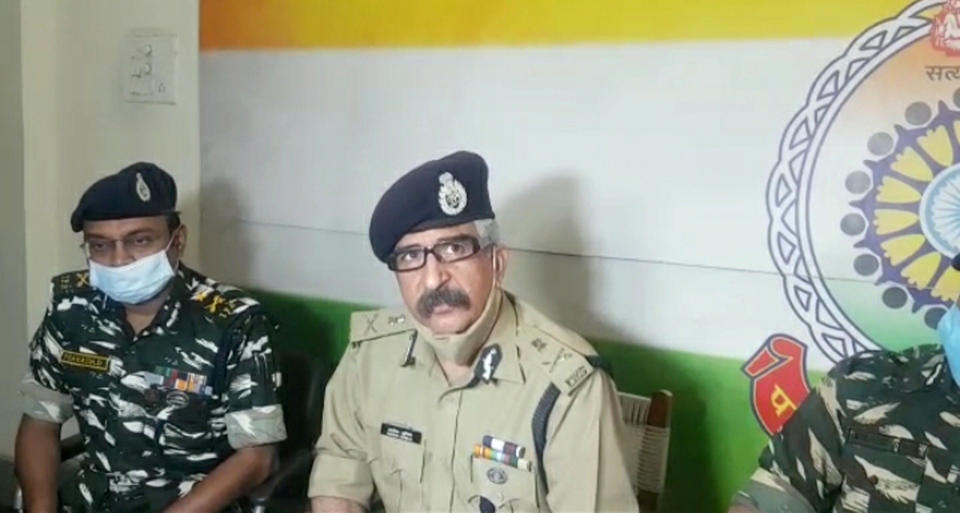 Ashok Juneja, the Inspector General for anti-Maoist operations, right, addresses the media in Raipur, India, Sunday, April 4, 2021. India on Sunday recovered the bodies of 20 police and paramilitary troops who were killed in a gunbattle with Maoist rebels a day earlier in the forests of the eastern Chhattisgarh state. (AP Photo)