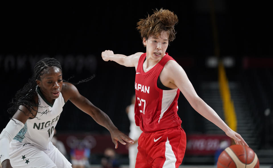 Japan's Saki Hayashi (27), right, steals the ball from Nigeria's Promise Amukamara (10), left, during women's basketball preliminary round game at the 2020 Summer Olympics, Monday, Aug. 2, 2021, in Saitama, Japan. (AP Photo/Charlie Neibergall)