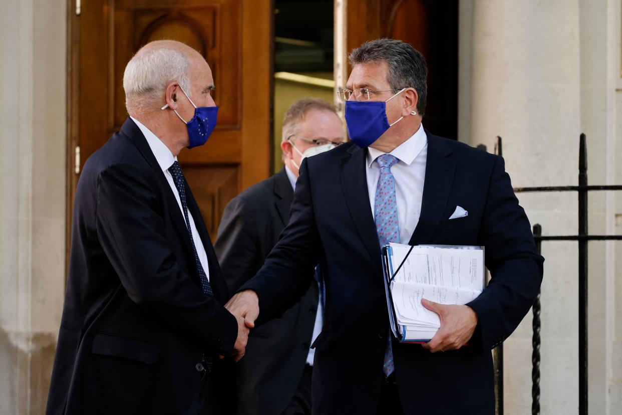 European Commission vice president Maros Sefcovic (R) leaves Europe House, the headquarters of the EU delegation in the UK in London on June 9, 2021. - The European Union on Wednesday threatened Britain with retaliatory action if it refuses to implement post-Brexit trading arrangements in Northern Ireland, after talks to solve the simmering row broke up without agreement. (Photo by Tolga Akmen / AFP) (Photo by TOLGA AKMEN/AFP via Getty Images)