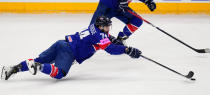 Britain's Ollie Betteridge reaches for the puck during the preliminary round match between Great Britain and Canada at the Ice Hockey World Championships in Prague, Czech Republic, Saturday, May 11, 2024. (AP Photo/Petr David Josek)