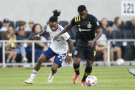Columbus Crew's Waylon Francis, right, tries to keep the ball away from D.C. United's Yordy Reyna during the first half of an MLS soccer match Wednesday, Aug. 4, 2021, in Columbus, Ohio. (AP Photo/Jay LaPrete)