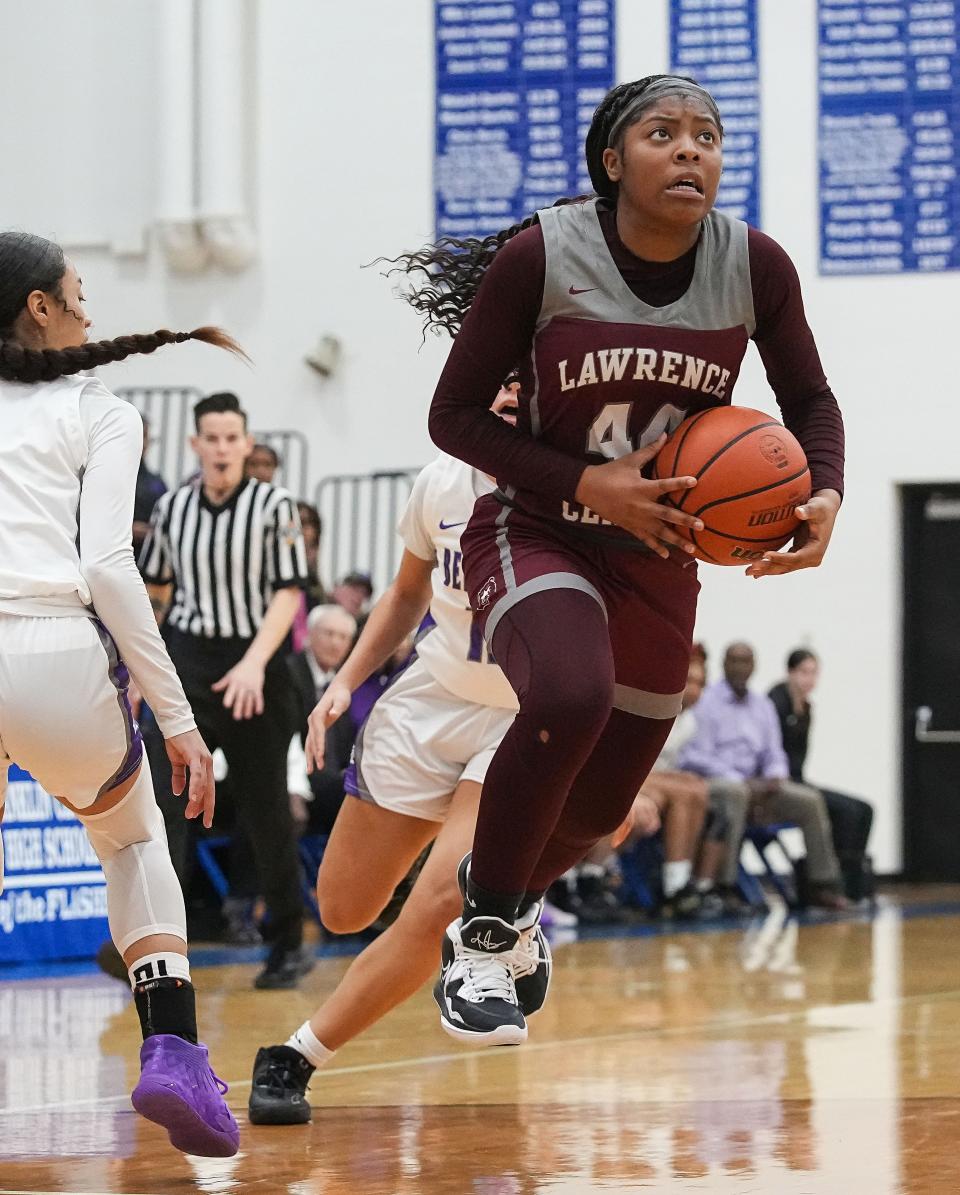 Lawrence Central Bears guard Laila Abdurraqib (44) attempts a lay-up on Saturday, Dec. 10, 2022 at Franklin Central High School in Indianapolis. Ben Davis Giants defeated the Lawrence Central Bears, 67-65. 