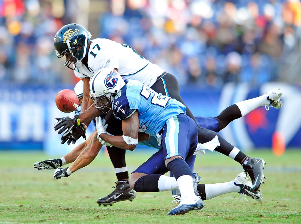 Alterraun Verner #20 and Jordan Babineaux #26 of the Tennessee Titans break up a pass intended for Chastin West #17 of the Jacksonville Jaguars during play at LP Field on December 24, 2011 in Nashville, Tennessee. The Titans won 23-17. (Photo by Grant Halverson/Getty Images)