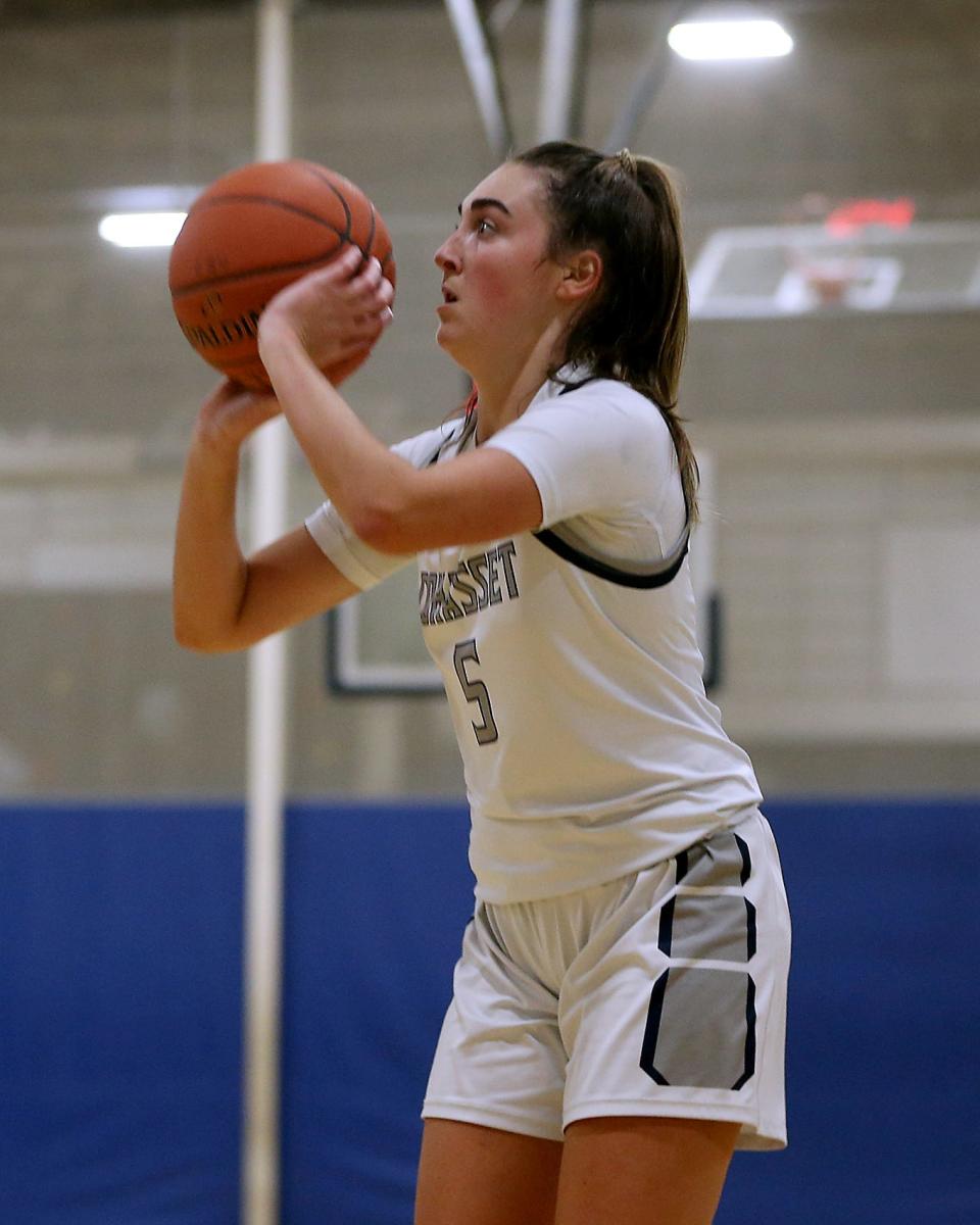 Cohasset's Laney Larsen rises up for a three pointer to give Cohasset the 40-23 lead over Hull during fourth quarter action of their game against Hull at Cohasset High on Friday, Jan. 6, 2023. 