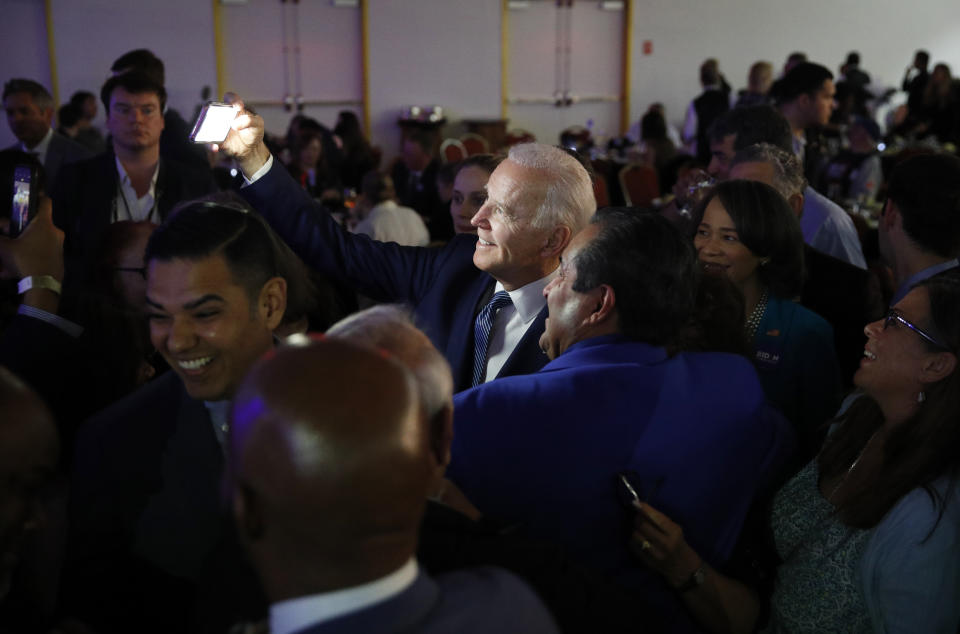 Democratic presidential candidate Former Vice President Joe Biden takes a selfie at the Clark County Democratic Party 'Kick-Off to Caucus 2020' event, Saturday, Feb. 15, 2020, in Las Vegas. (AP Photo/John Locher)