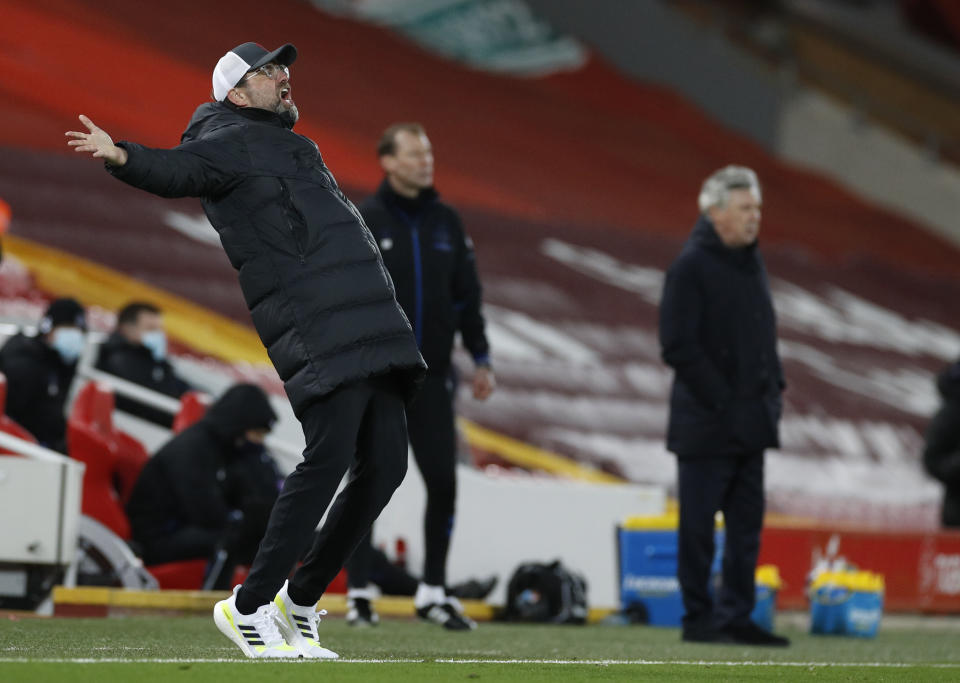 Liverpool's manager Jurgen Klopp reacts during the English Premier League soccer match between Liverpool and Everton at Anfield in Liverpool, England, Saturday, Feb. 20, 2021. (Phil Noble/ Pool via AP)