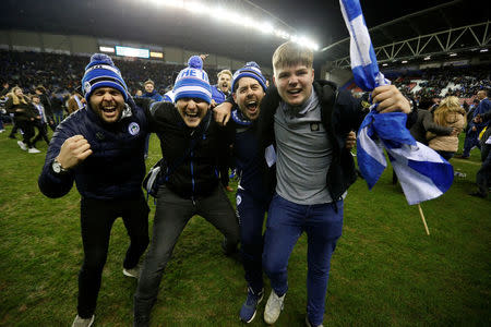 Soccer Football - FA Cup Fifth Round - Wigan Athletic vs Manchester City - DW Stadium, Wigan, Britain - February 19, 2018 Wigan Athletic fans celebrate on the pitch after the match Action Images via Reuters/Carl Recine