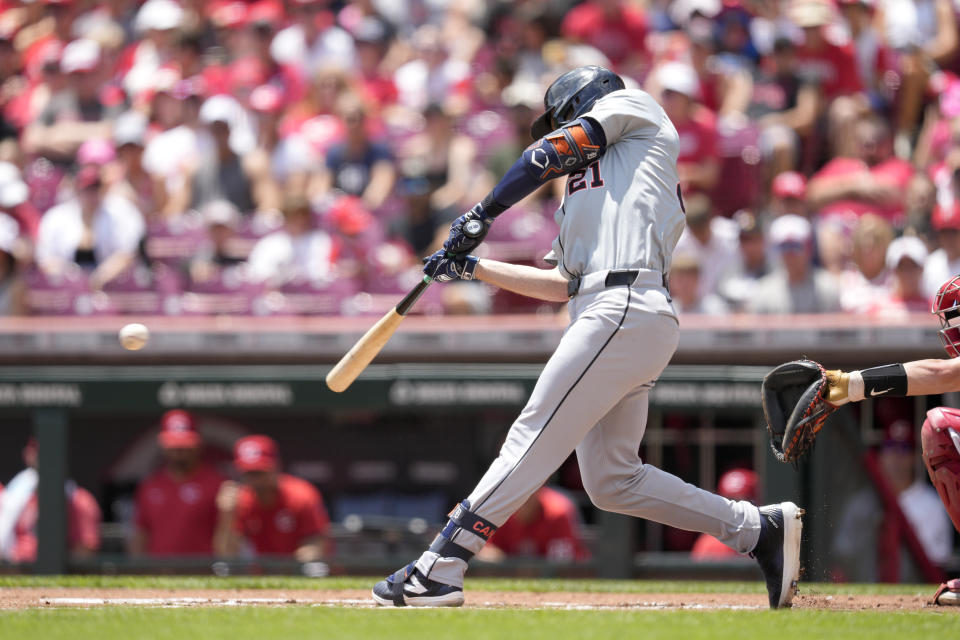 Detroit Tigers' Mark Canha hits a single in the first inning of a baseball game against the Cincinnati Reds in Cincinnati, Sunday, July 7, 2024. (AP Photo/Jeff Dean)