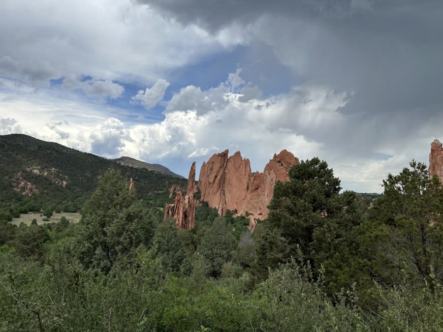 Red rocks at Garden of the Gods with storm clouds seen on June 8, 2024. (Brooke Williams)
