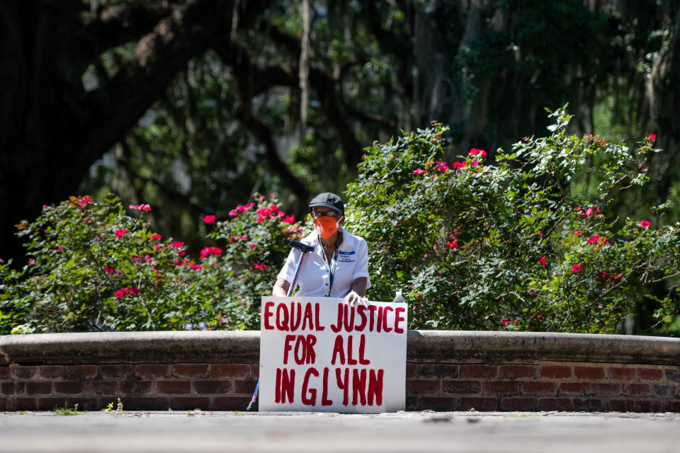 BRUNSWICK, GA - MAY 08: A demonstrators protests the shooting death of Ahmaud Arbery at the Glynn County Courthouse on May 8, 2020 in Brunswick, Georgia. Gregory McMichael and Travis McMichael were arrested the previous night and charged with murder. (Photo by Sean Rayford/Getty Images)