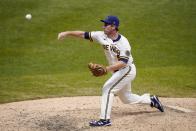 Milwaukee Brewers' Jedd Gyorko pitches during the ninth inning of a baseball game against the Minnesota Twins Wednesday, Aug. 12, 2020, in Milwaukee. (AP Photo/Morry Gash)