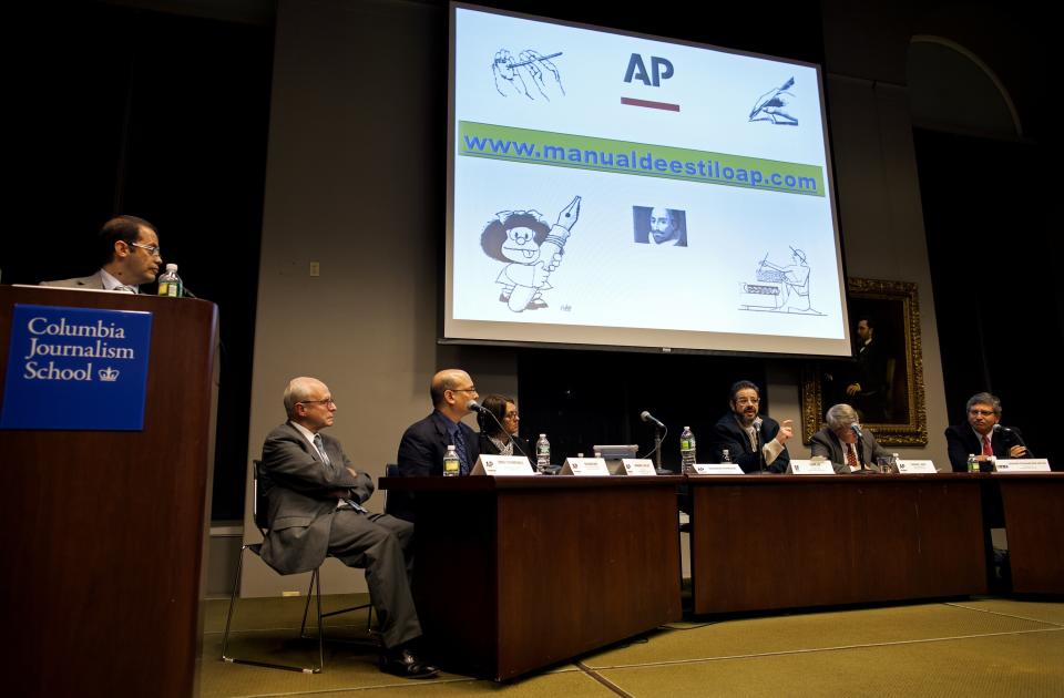 FILE - This Monday, Nov. 19, 2012, file photo, moderator Alejandro Manrique, left, the Associated Press deputy editor for Latin America, and director of the AP Spanish Service, looks towards journalists gathered at Columbia University to discuss the launch of the Associated Press' first Spanish-Language stylebook, in New York. Members of the panel took questions and discussed why and how the stylebook was formulated. (AP Photo/Craig Ruttle, File)