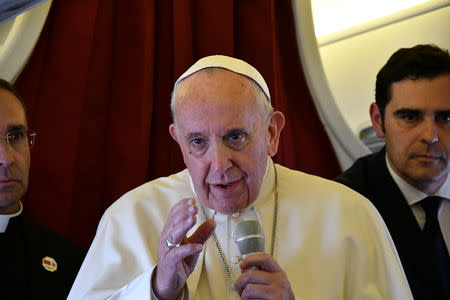 Pope Francis addresses reporters aboard the plane bringing him back following a two-day trip to Morocco March 31, 2019. Alberto Pizzoli/Pool via REUTERS