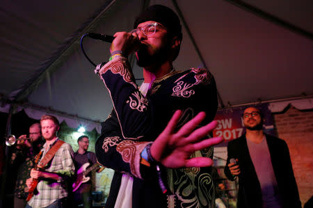 Kayem, who is Libyan-American, performs with Bassel and the Supernaturals, led by Bassel Almadani, who is first-generation Syrian American, at the ContraBand Showcase featuring artists representing countries included in U.S. President Donald Trump's executive order travel bans, at the South by Southwest (SXSW) Music Film Interactive Festival 2017 in Austin, Texas, U.S. March 18, 2017. REUTERS/Brian Snyder