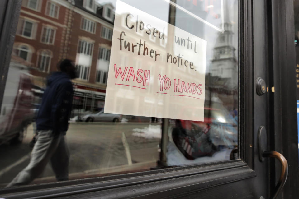 FILE - In this March 25, 2020, file photo, a closed sign hangs in the window of a shop in Portsmouth, N.H. Most of the restaurant and retail businesses in the city have closed, with some offering takeout or pick-up orders, due to the virus outbreak. (AP Photo/Charles Krupa, File)