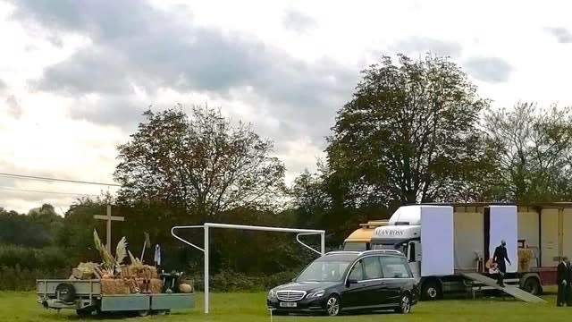 Drive in funeral for farmer