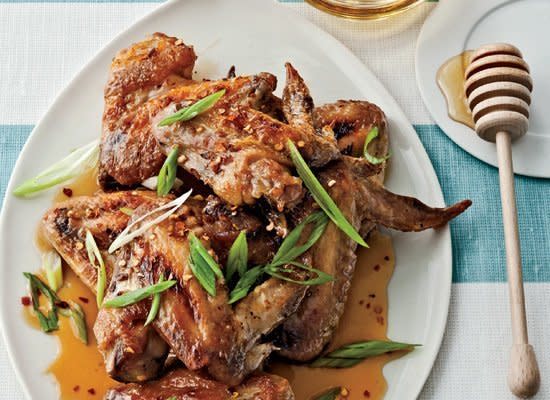 <strong>Get the <a href="http://www.huffingtonpost.com/2011/10/27/honey-chile-chicken-wings_n_1060867.html" target="_hplink">Honey-Chile Chicken Wings recipe</a></strong>