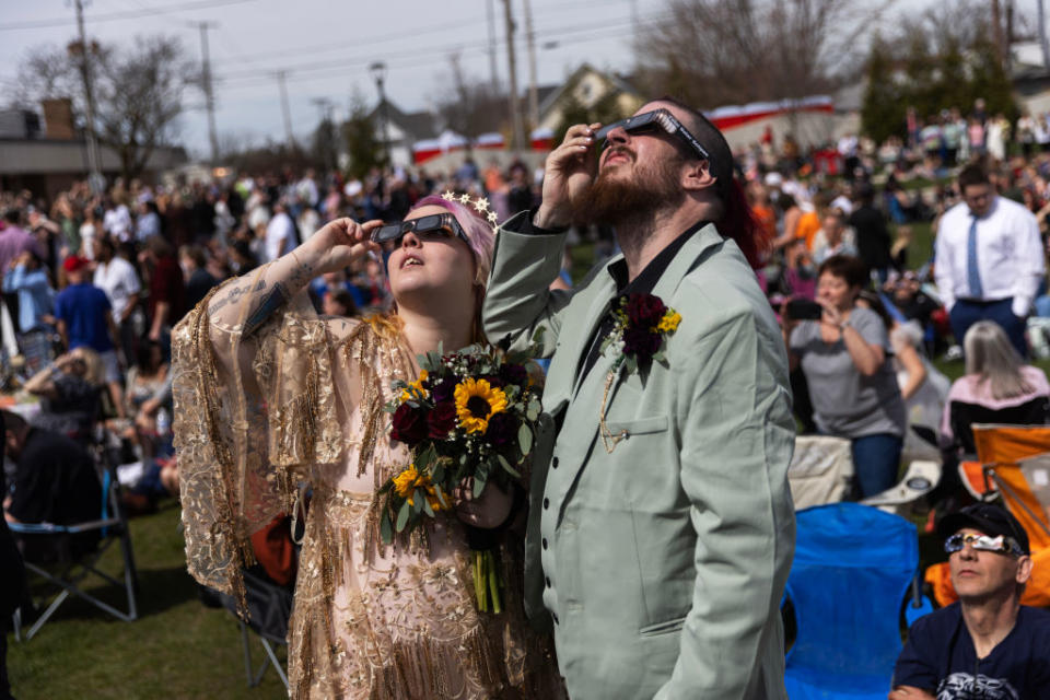 Eclipse watchers in Tiffin Ohio had extra cause to celebrate the eclipse as 100 couples tied the knot during totality