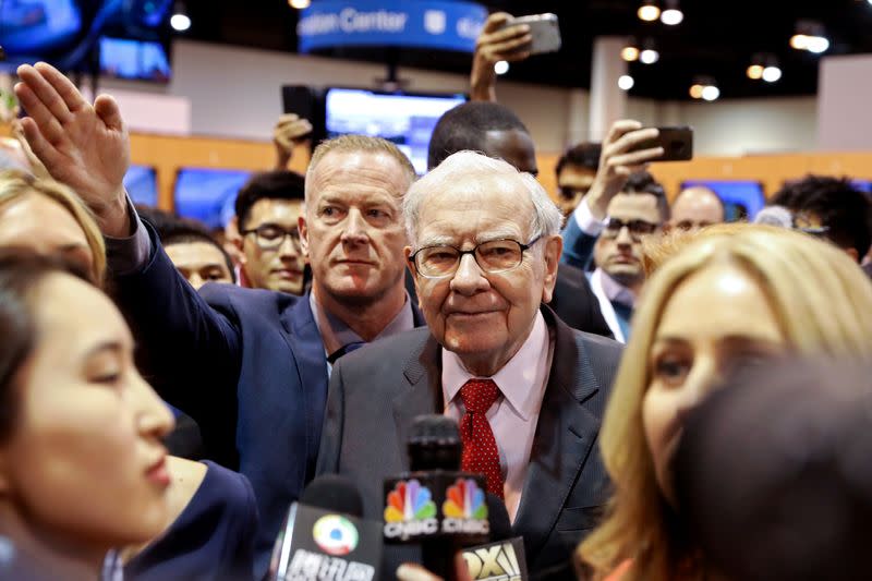 FILE PHOTO: Berkshire Hathaway Chairman Warren Buffett walks through the exhibit hall as shareholders gather to hear from the billionaire investor at Berkshire Hathaway Inc's annual shareholder meeting in Omaha