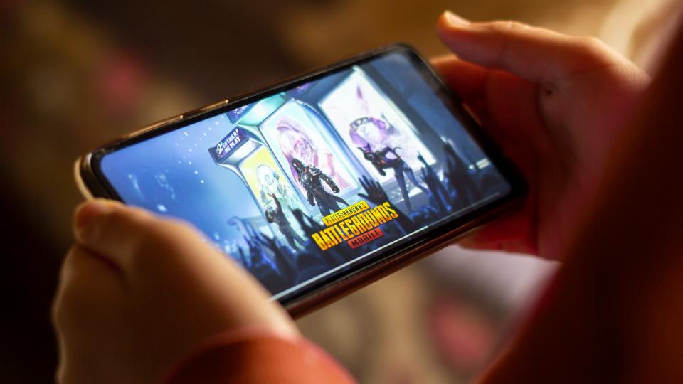 Khemisset, Morocco - april 14, 2020: Close up gamer hand holding a smartphone with Playerunknown's Battlegrounds.