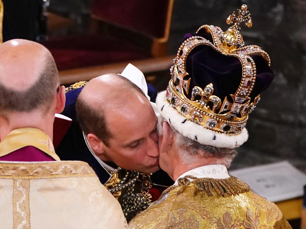 The Prince of Wales kisses his father (Getty Images)
